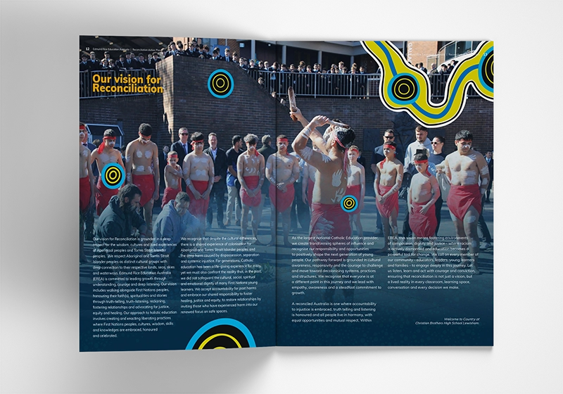 Two-page brochure spread titled 'Our vision for Reconciliation' showing a group of shirtless men in red briefs in a courtyard, with a crowd watching and circular decorative graphics nearby.